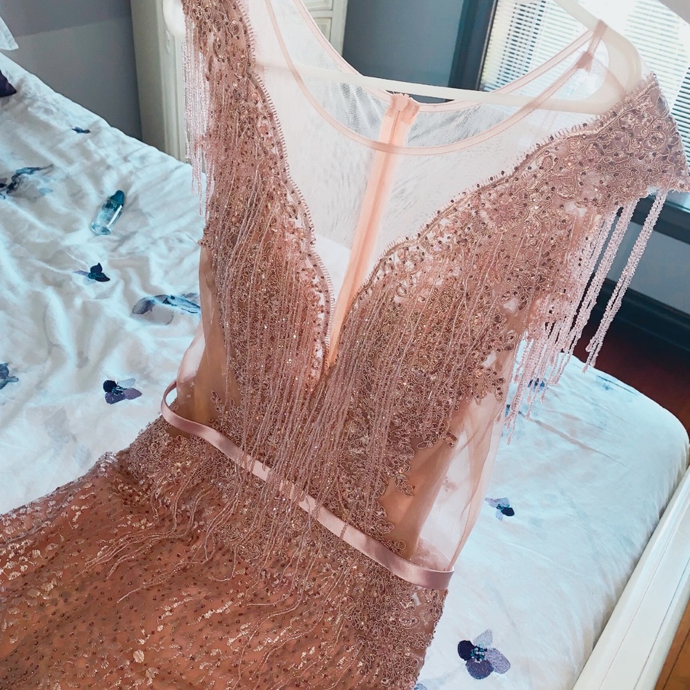 Blush pink dress with beaded details.